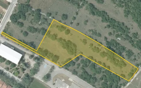 Šibenik, Unešić - građevinsko zemljište s projektom, 13459m2